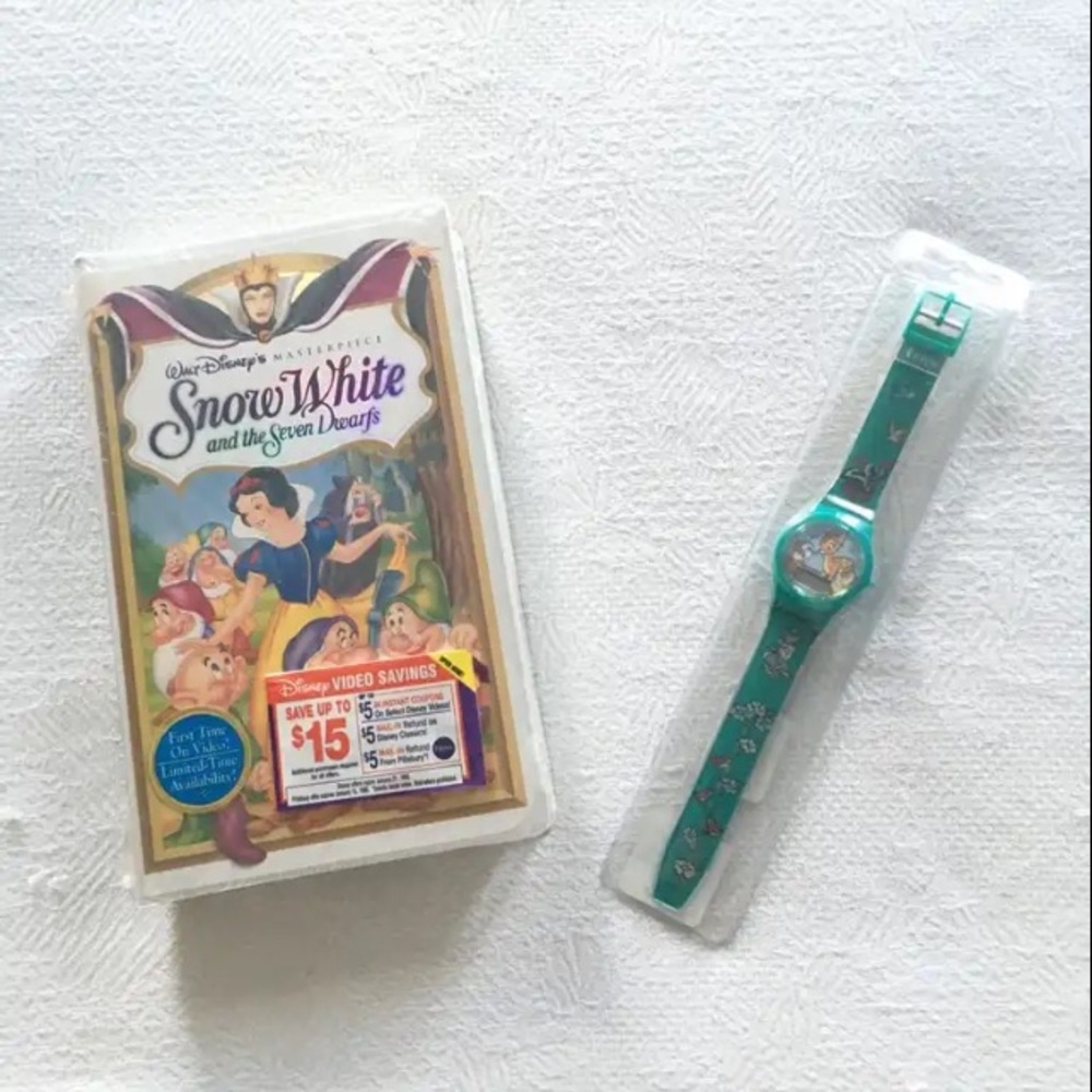 Never opened Mint Condition Disney’s Snow White VHS tape & sealed Bambi watch.